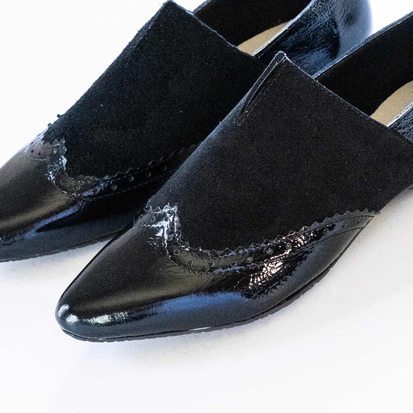 TWO BLACK LEATHER FLATS