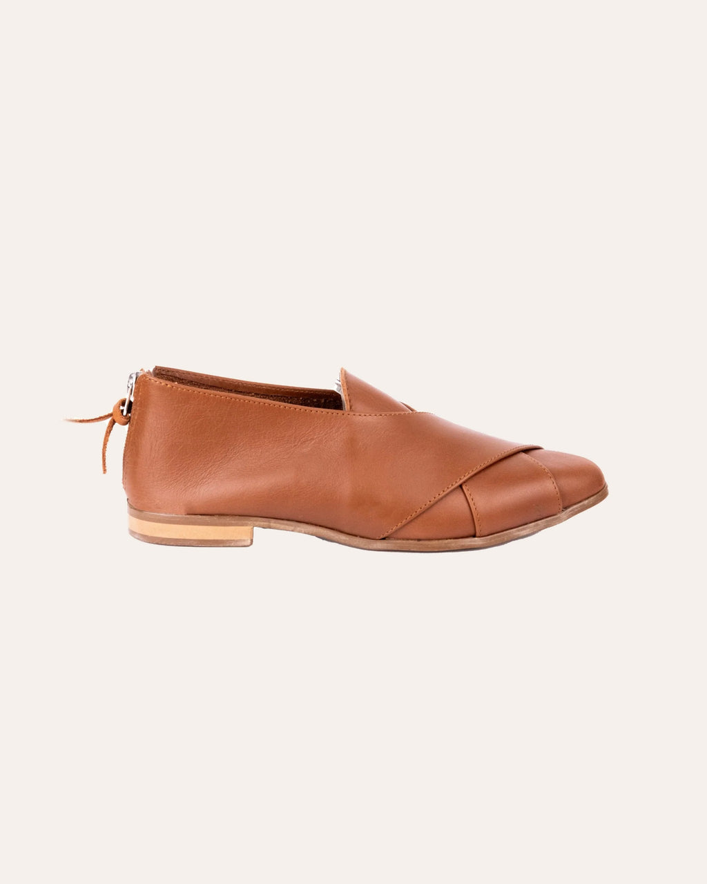 Crossover Pixie – tan leather flat with a crossover strap and back zip, side view, handmade by Phelan