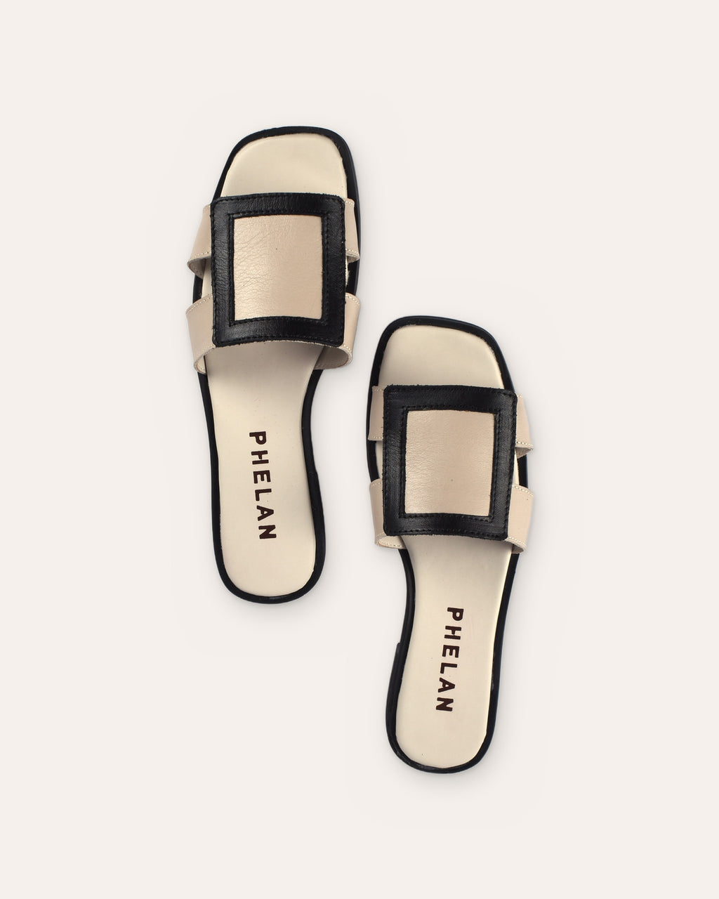 Coco Slide in Mink/Black leather from above, showing the PHELAN footbed
