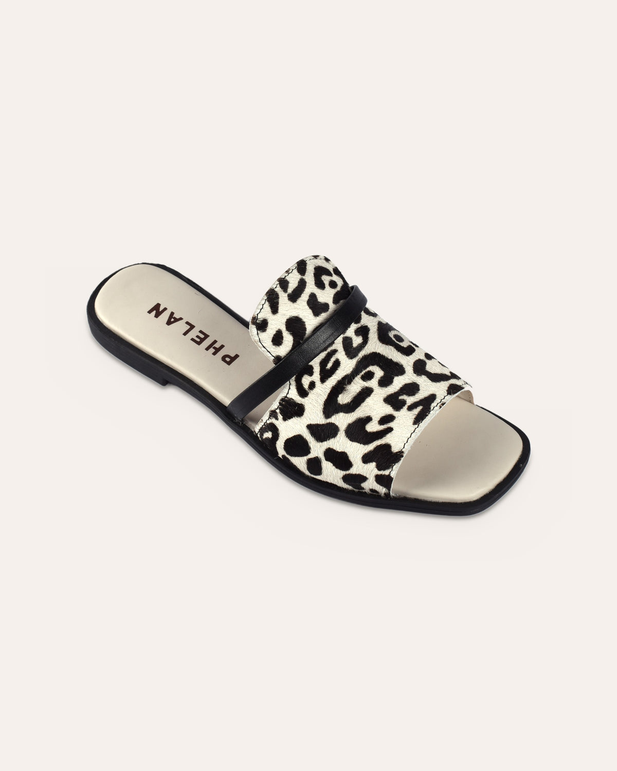 Sabi Slide from the heel end, showing the PHELAN footbed