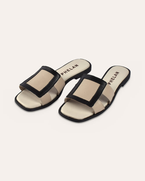 Coco Slide in Taupe/Black leather, pair from the front three-quarter