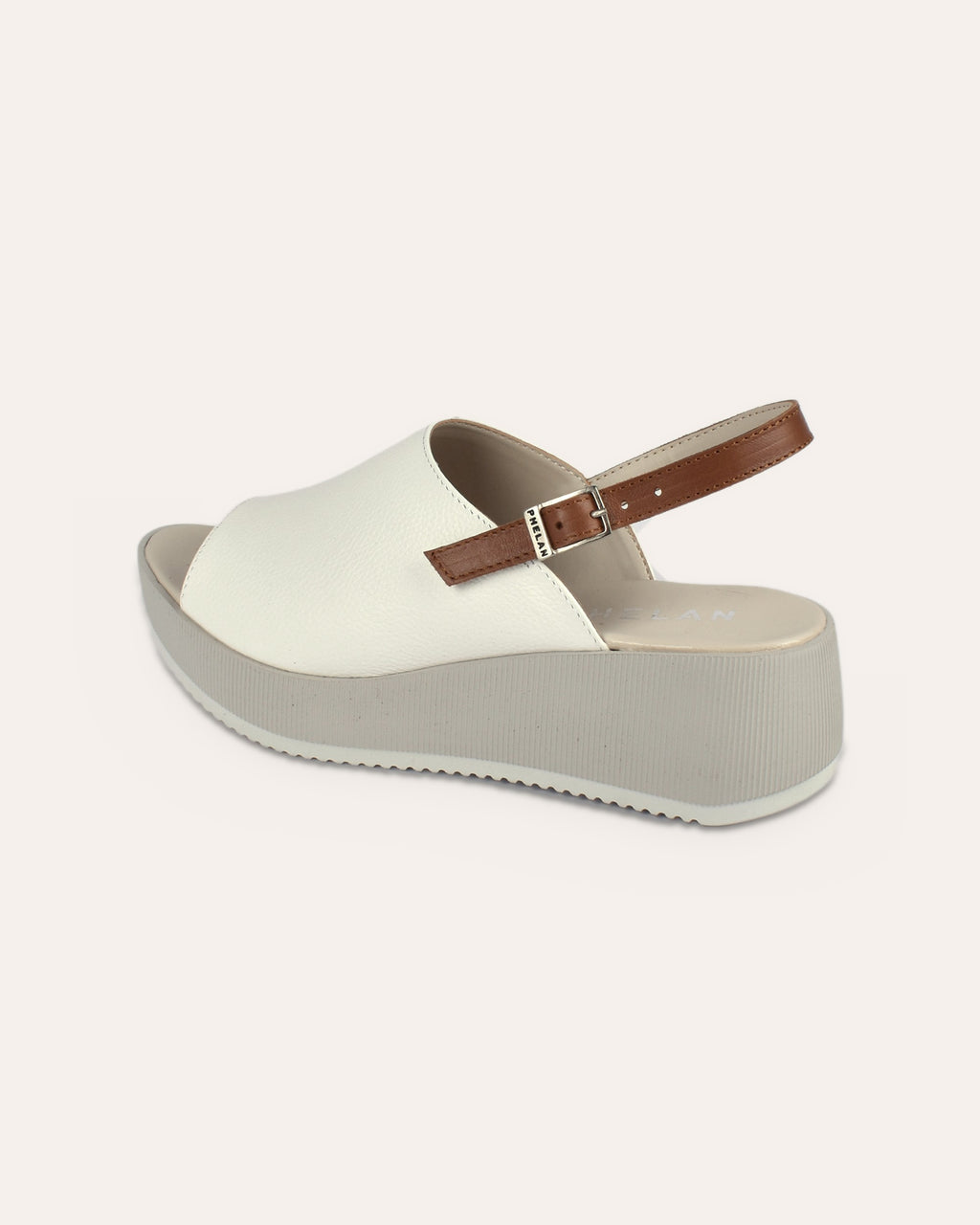 Corsica Platform in White/Tan, one shoe from the heel side