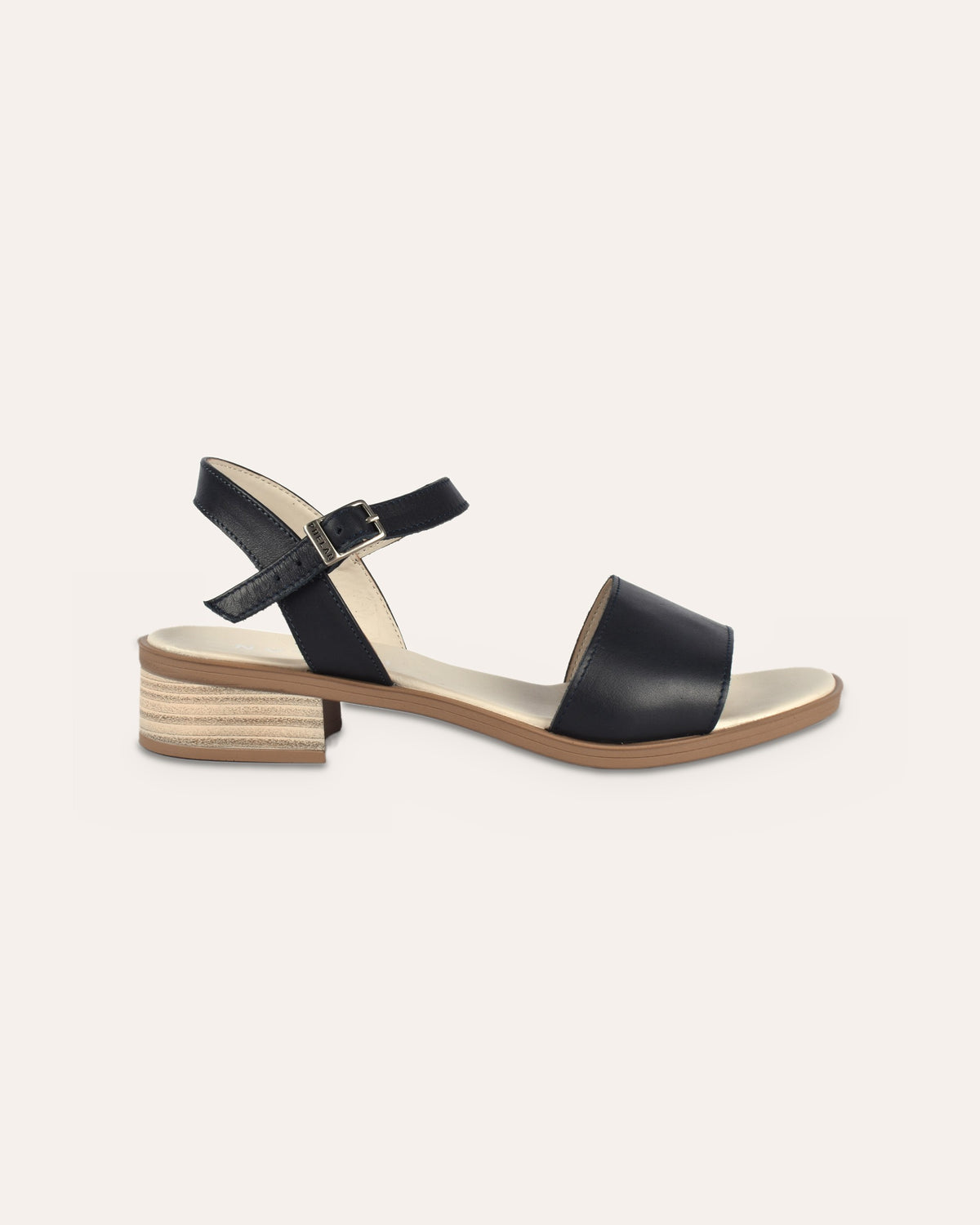 Stella Heel in Navy, side view of the stacked block heel