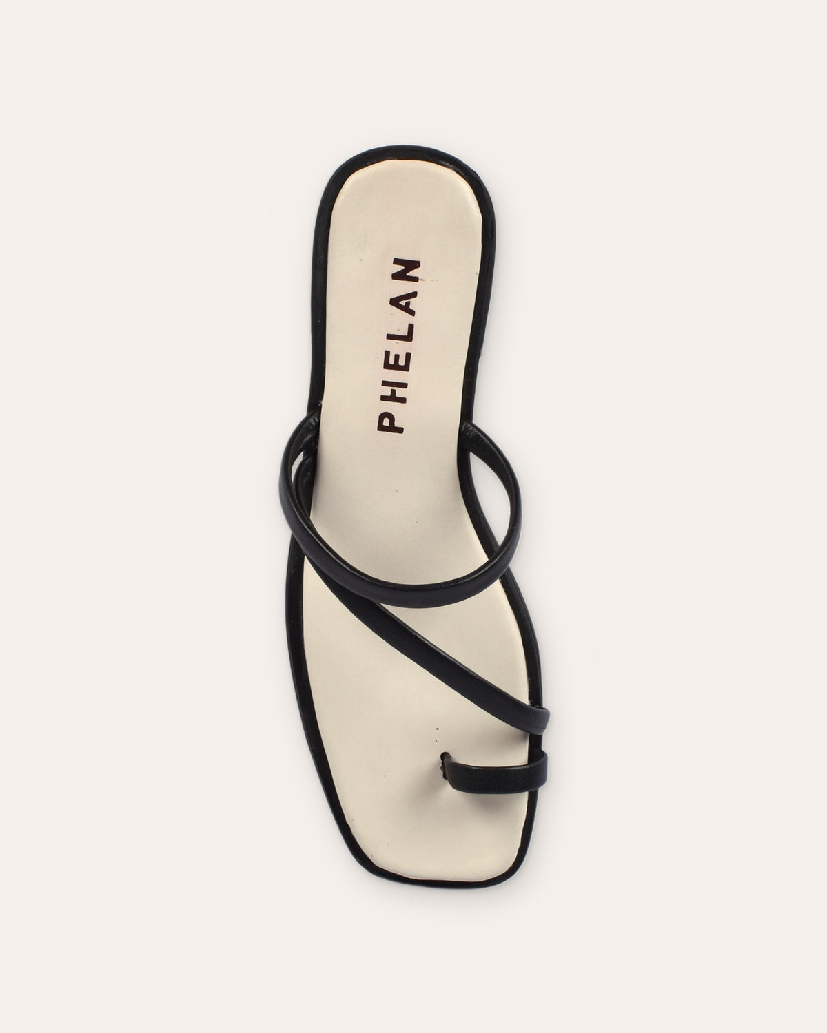 Lipari Slide in Black, one shoe from above