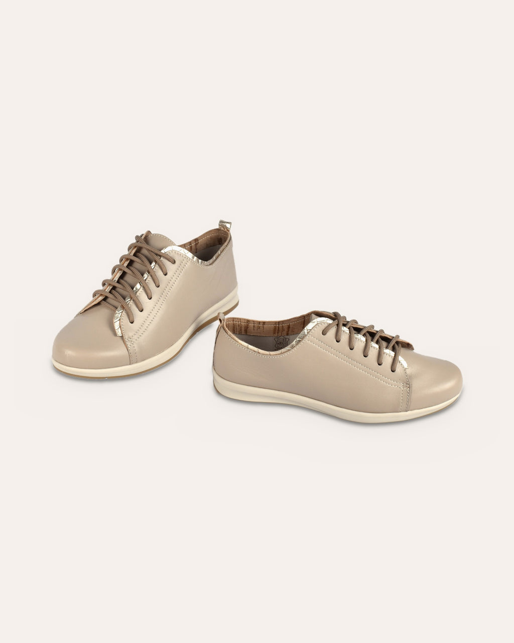 Hydra Sneaker in Taupe/Gold, the pair staggered