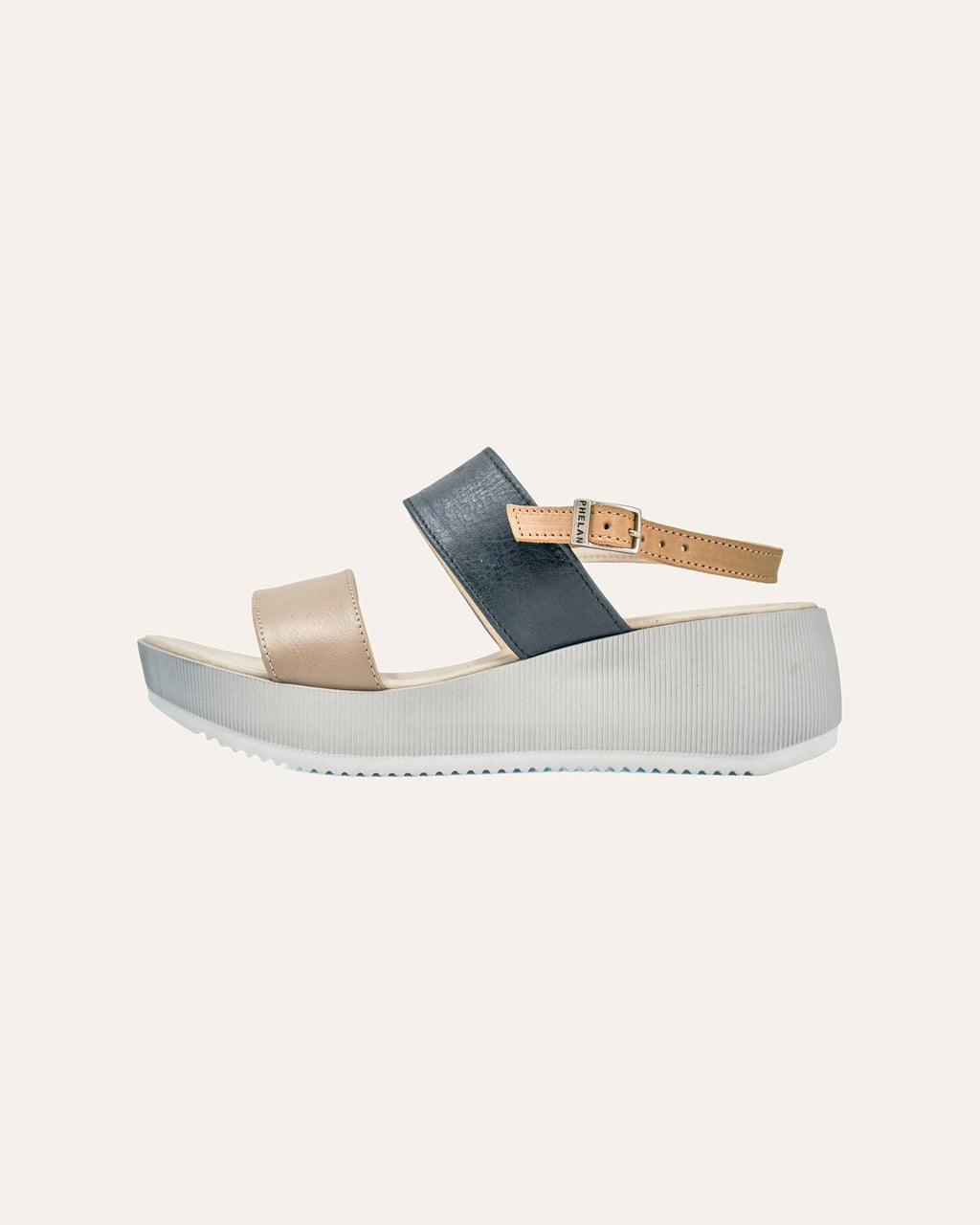 Portofino Platform in Mink/Navy/Tan from the side, showing the ribbed platform and tan strap