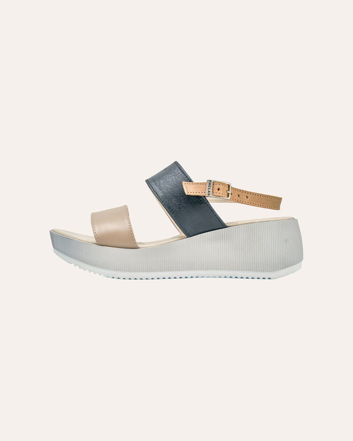 Portofino Platform in Mink/Navy/Tan from the side, showing the ribbed platform and tan strap