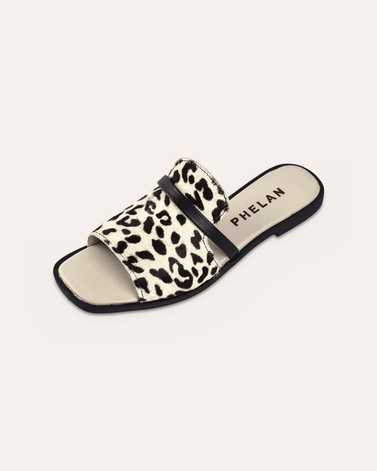 Sabi Slide single shoe, snow leopard hair-on upper with black leather strap