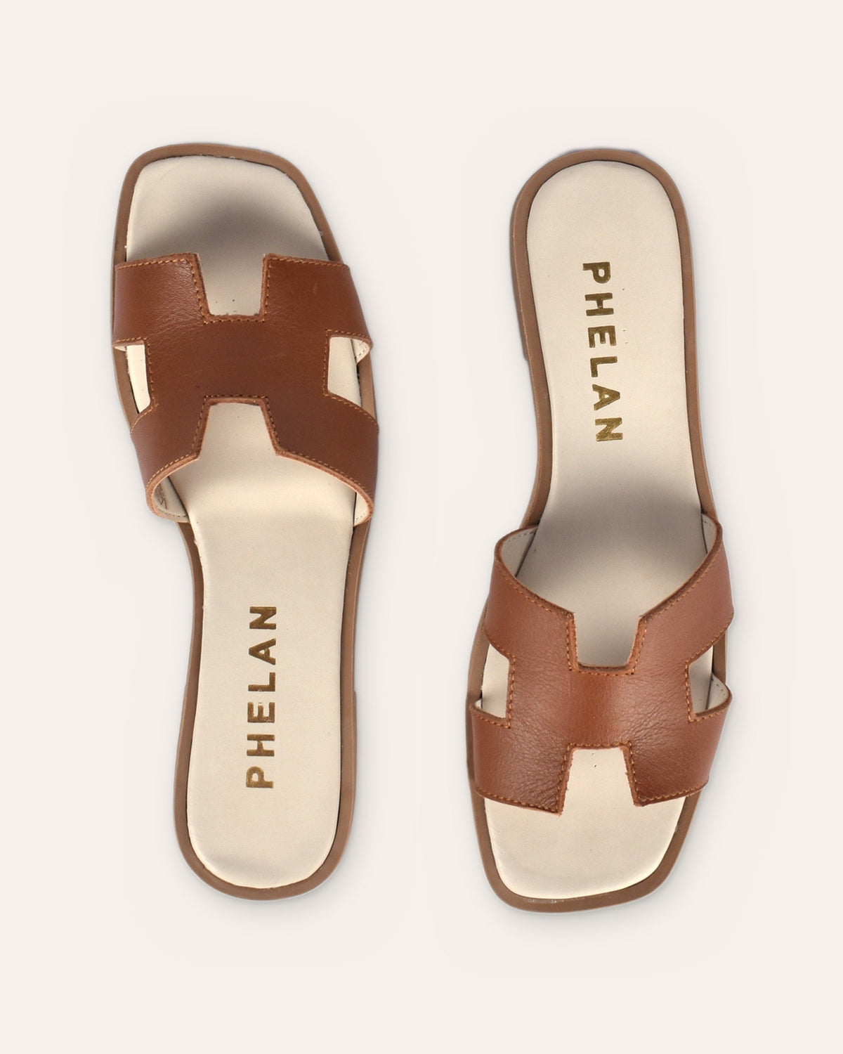Santorini Slide in Tan from above, showing the H-cut strap and ivory footbed