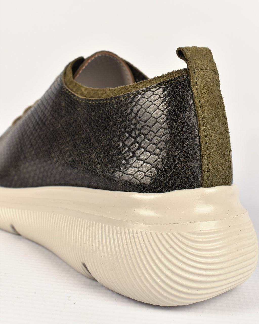 Deck Sneaker in Olive/Olive, close-up of the olive suede heel tab