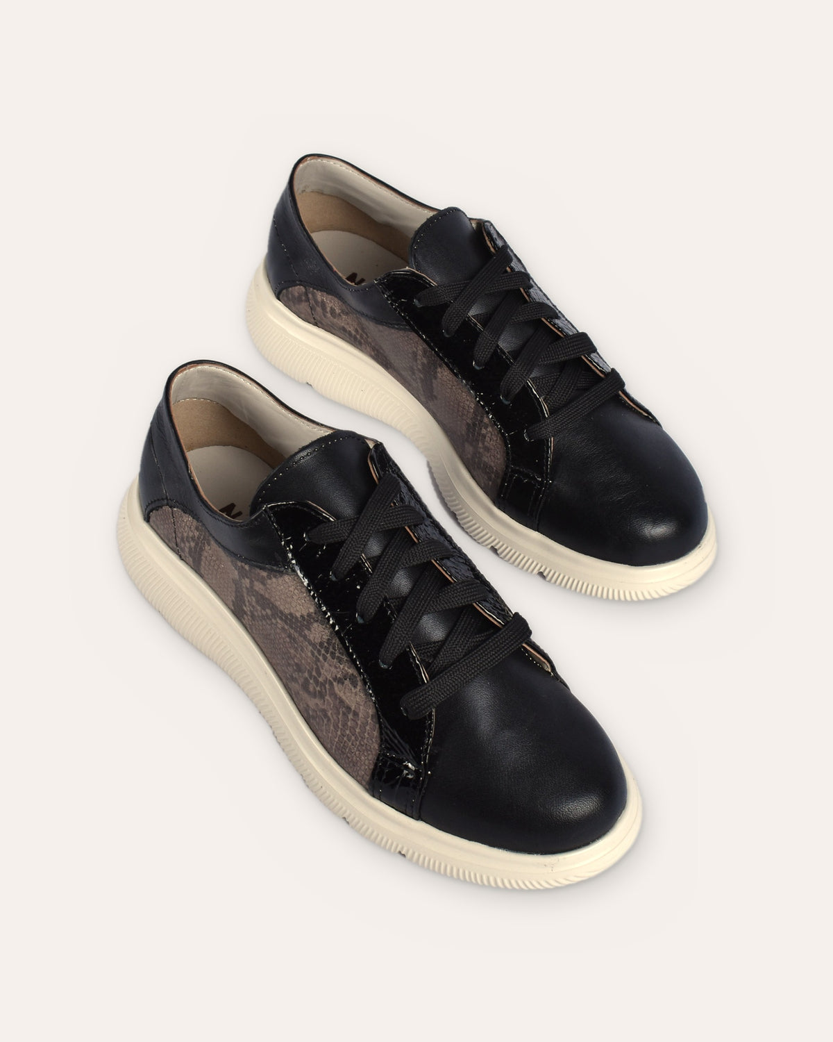 Harbour Sneaker in Black/Snake, the pair from the toe end