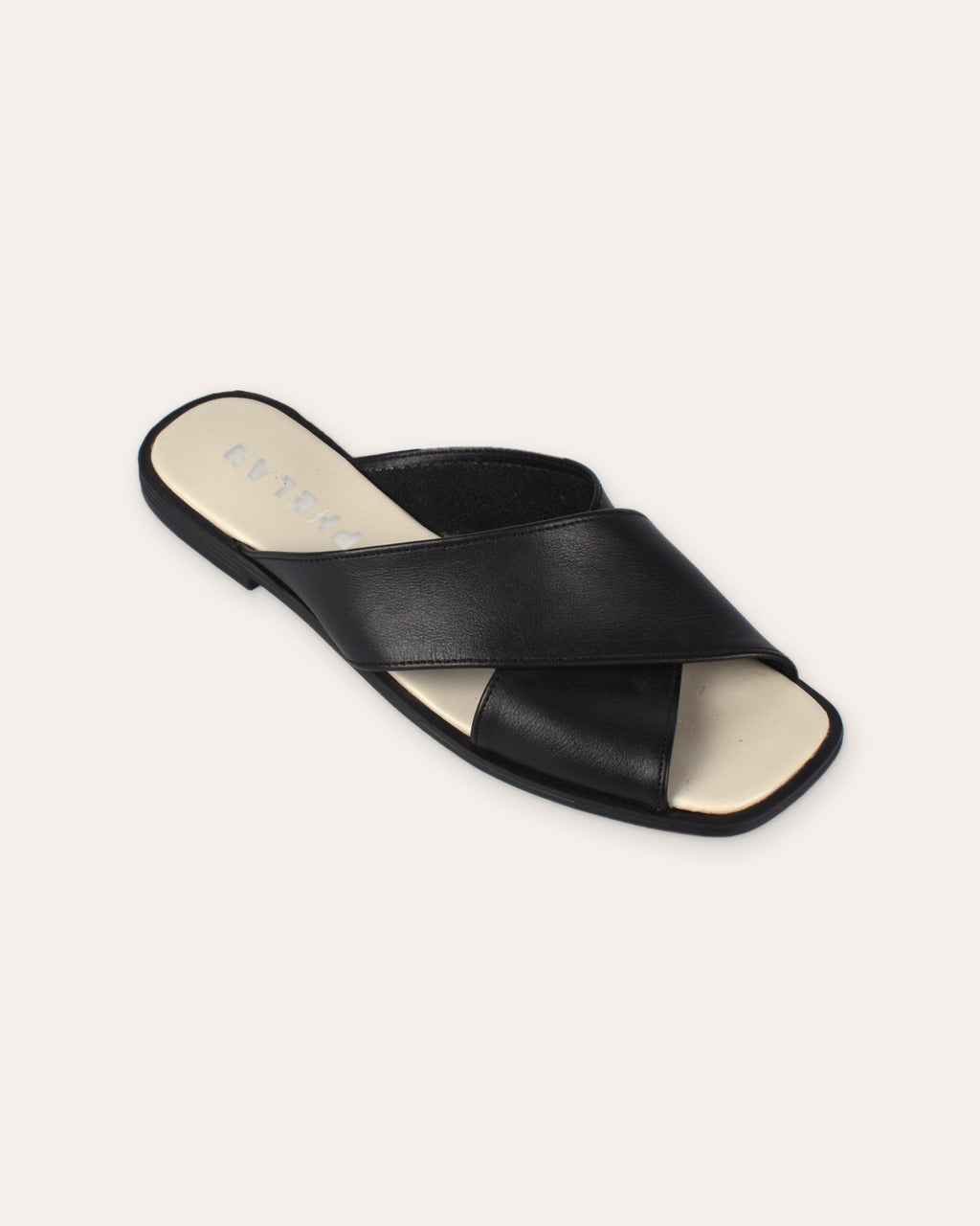 Elba Slide in Black, one shoe close