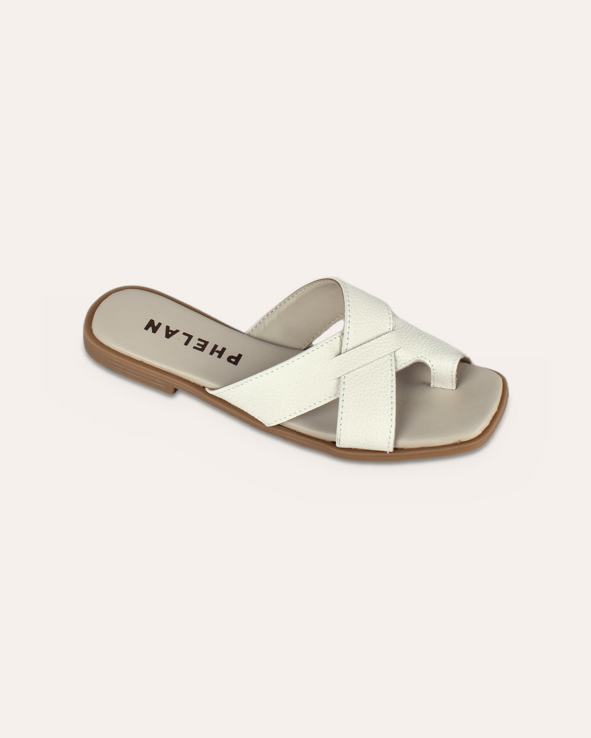 Isla Slide in White, one shoe close
