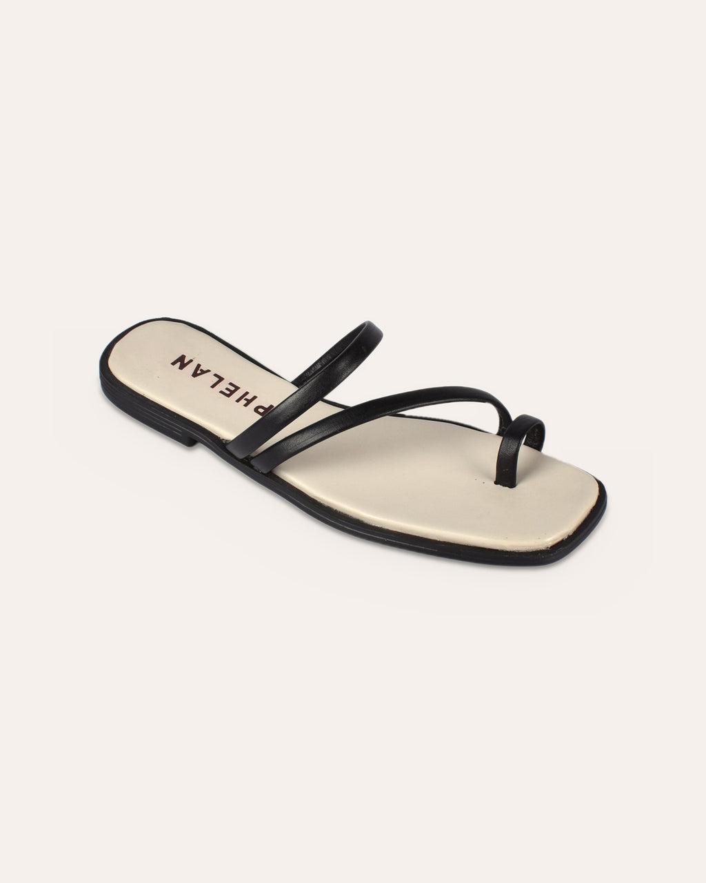 Lipari Slide in Black, one shoe close