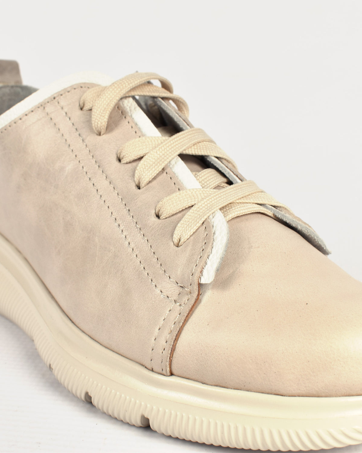 Deck Sneaker in Stone/White, close-up of the laces and toe