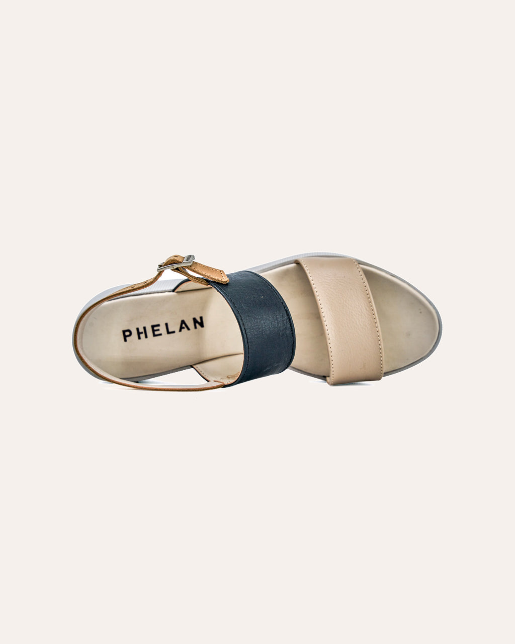 Portofino Platform in Mink/Navy/Tan tipped on its side, showing the footbed