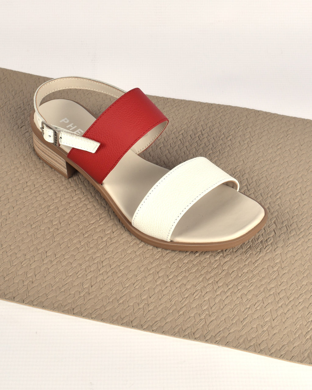 Portofino Heel in White/Red on a woven taupe mat