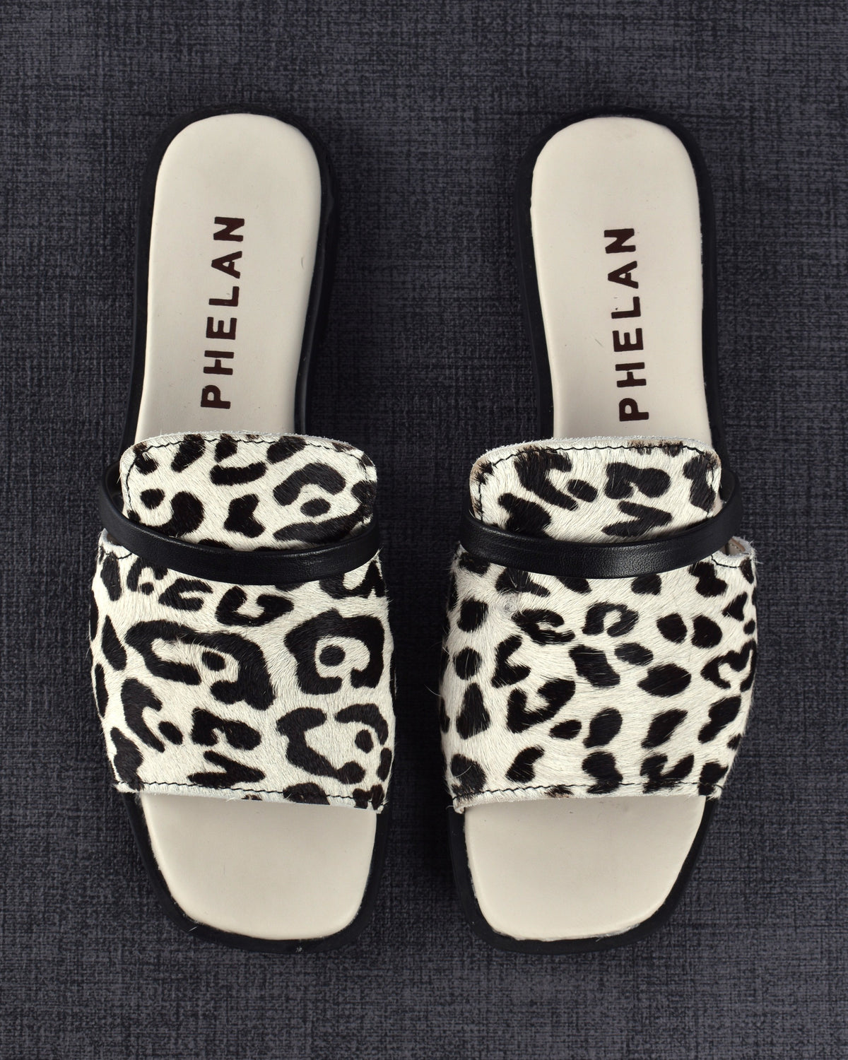 Sabi Slide pair from directly above on a charcoal linen mat