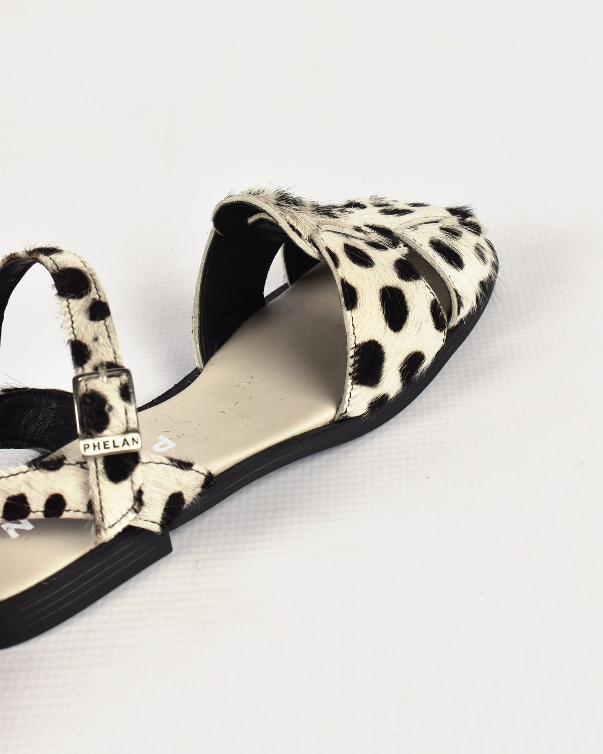 Bosun Sandal in Dalmatian, close-up of the hair-on leather and PHELAN buckle
