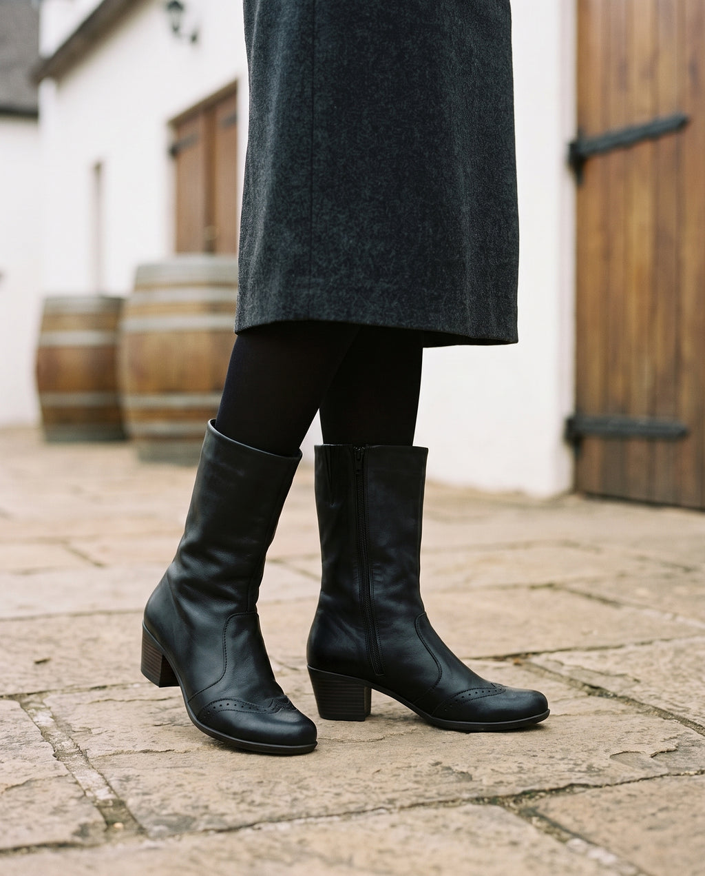 Ines Mid-Calf Boot in Black, worn