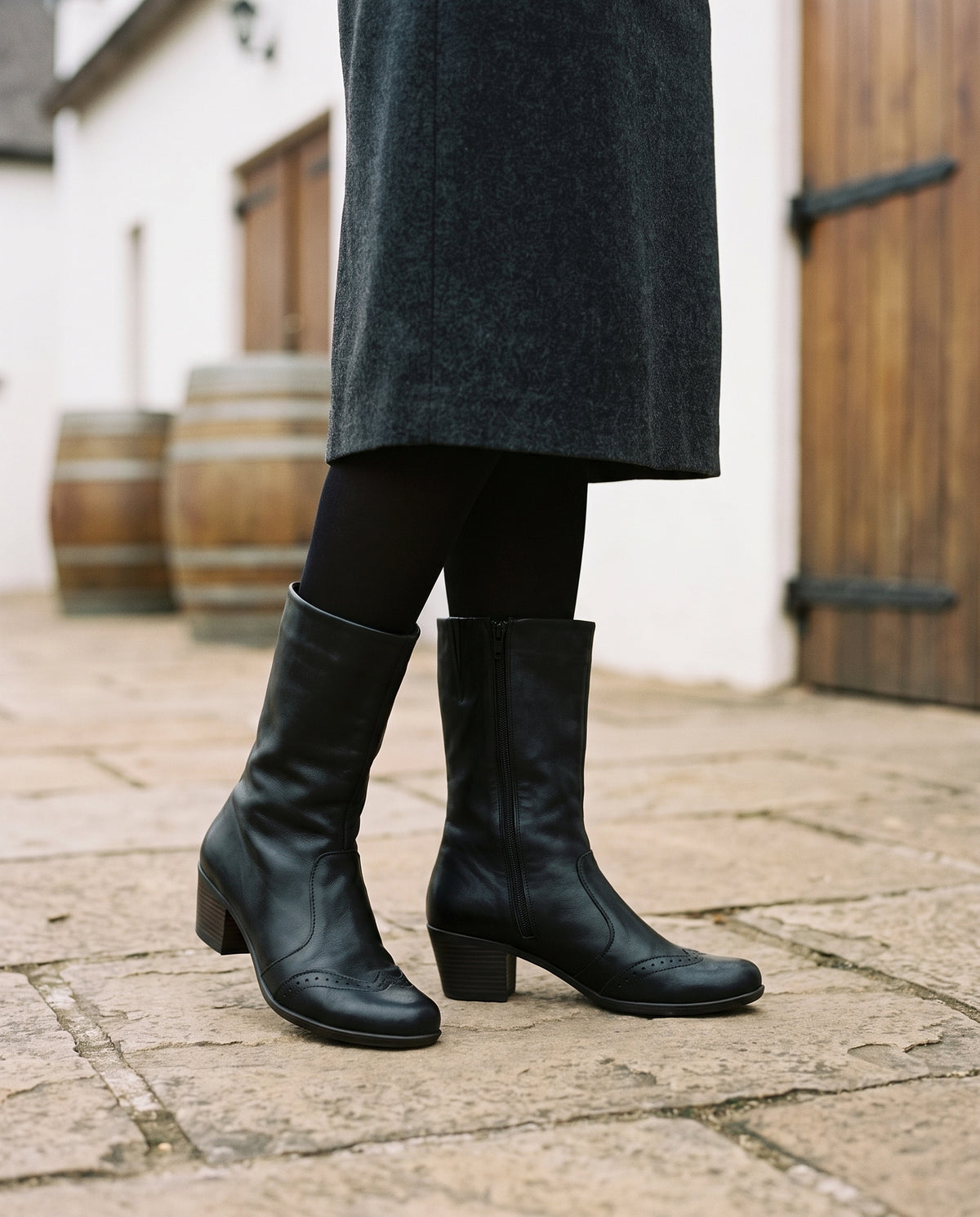 Ines Mid-Calf Boot in Black, worn
