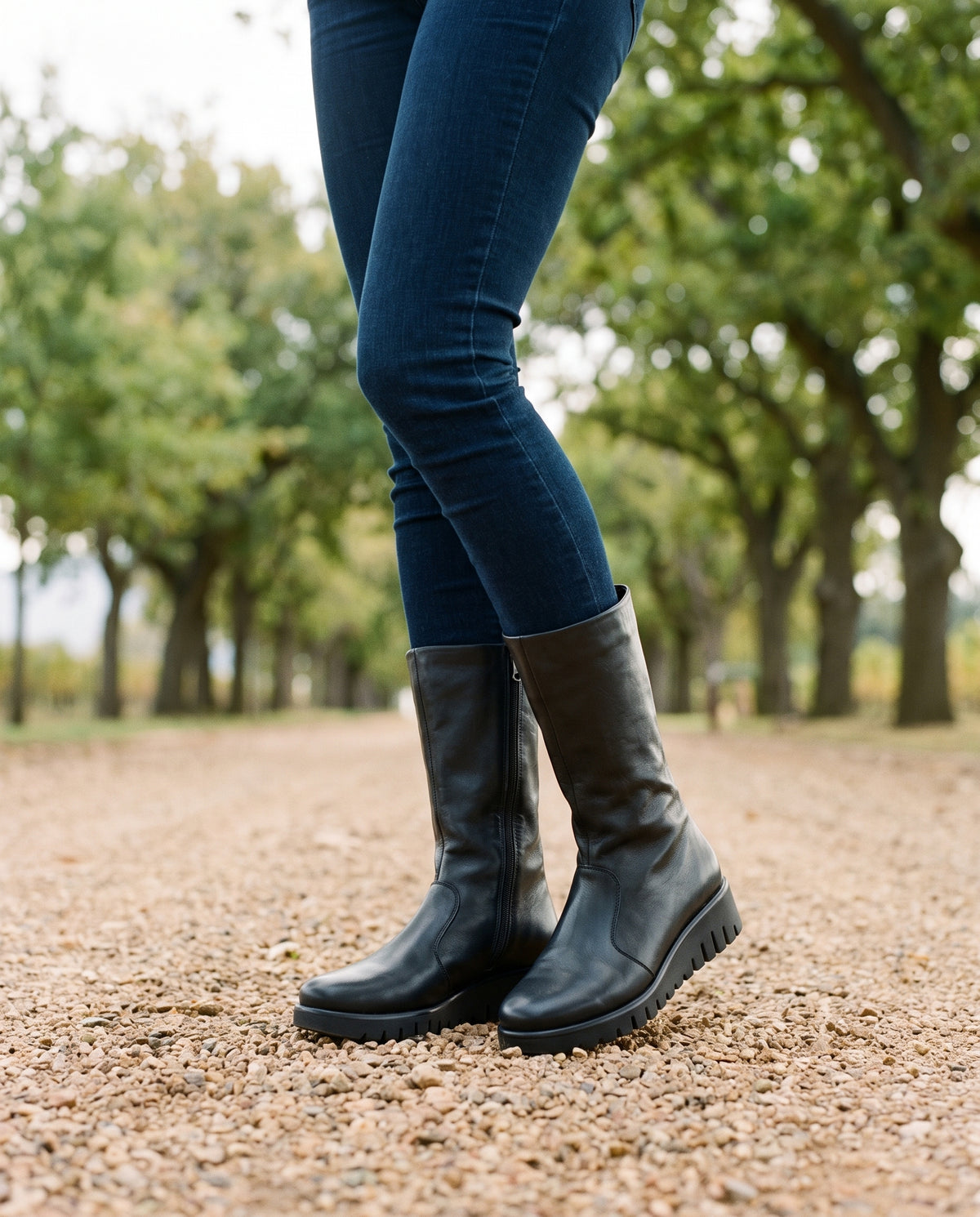 Sienna Tall Boot in Black, worn