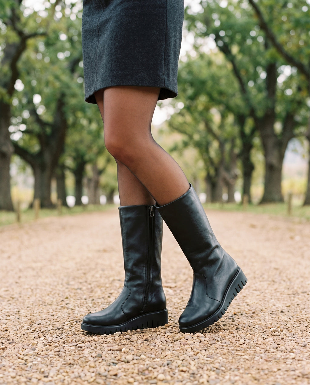 Sienna Tall Boot in Black, worn