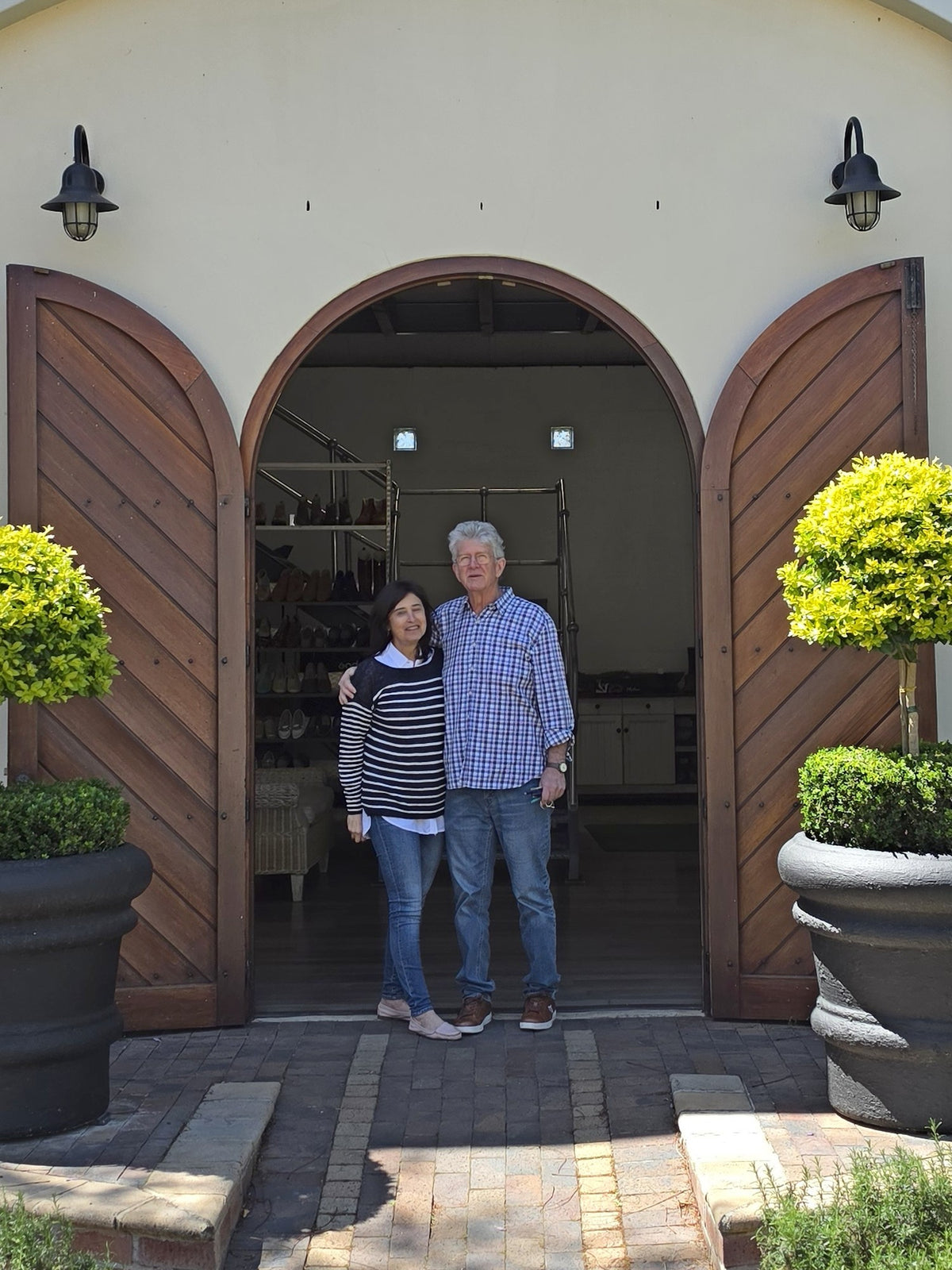 Michael and Tina in the arched doorway of the Phelan factory shop