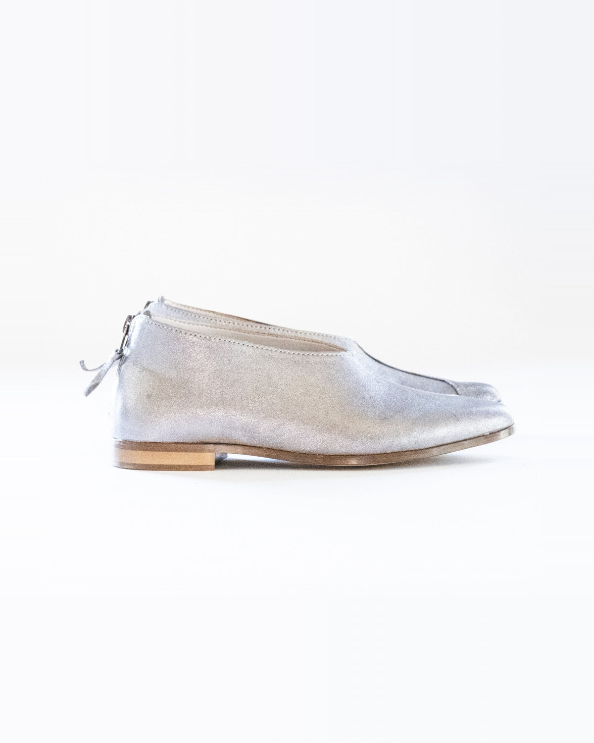 Silver Zoo Flats – metallic silver leather slip-on flat with a back zip, side view, handmade by Phelan