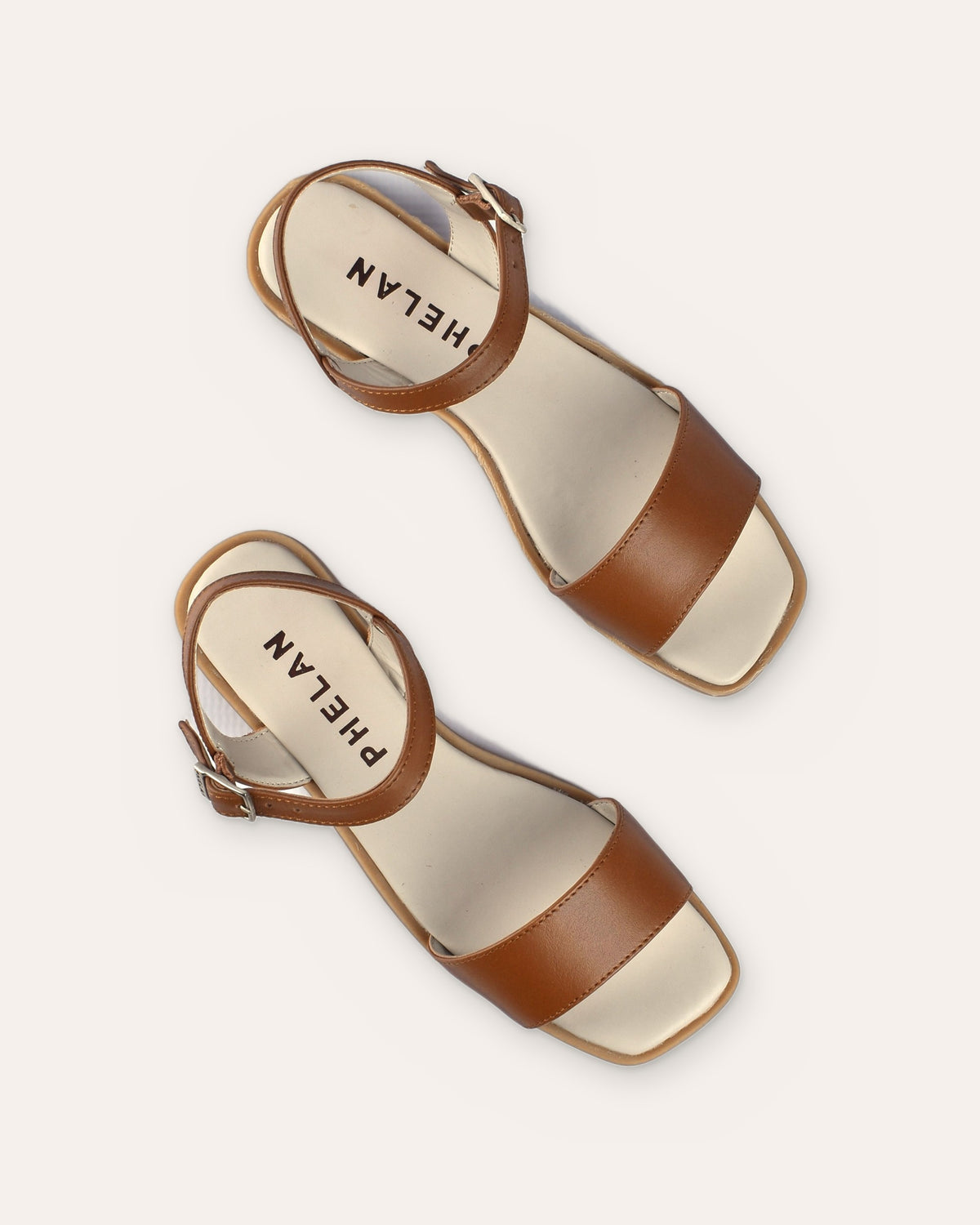 Stella Sandal in Tan from above, showing the wide toe band and buckled ankle strap